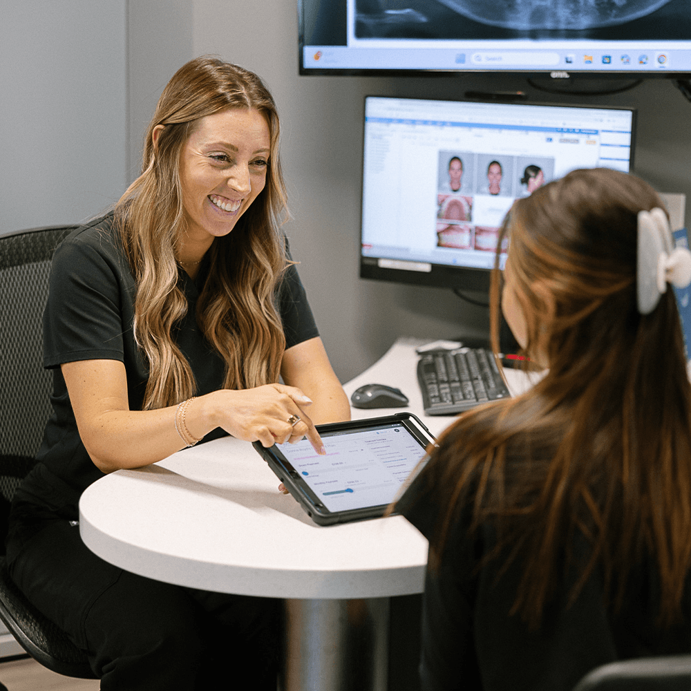 Dentist Speaking With Patient